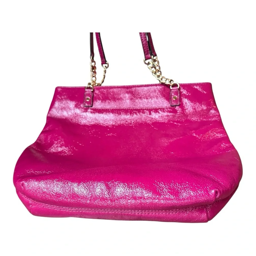 Michael Kors patent leather handbag in a sleek, glossy finish.